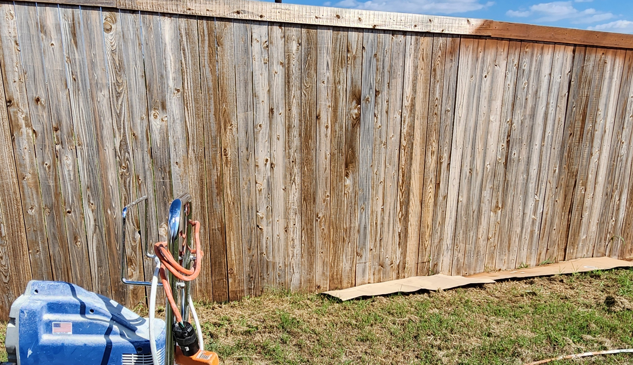 Stain faded fence showing deterioration